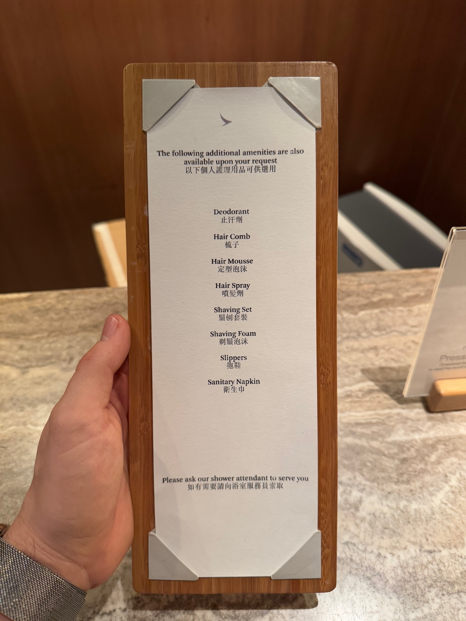 a hand holding a menu