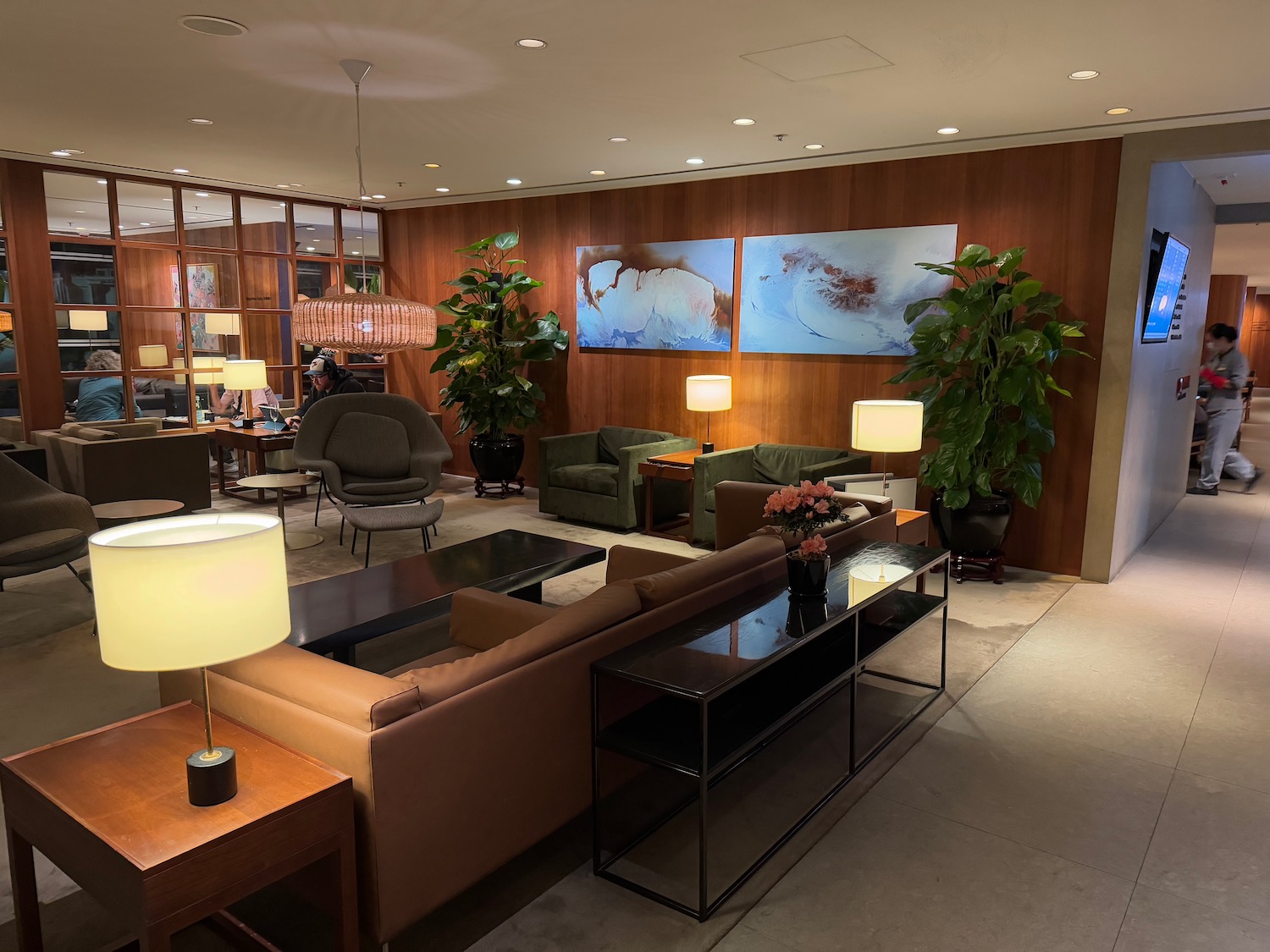 a room with a couch and chairs