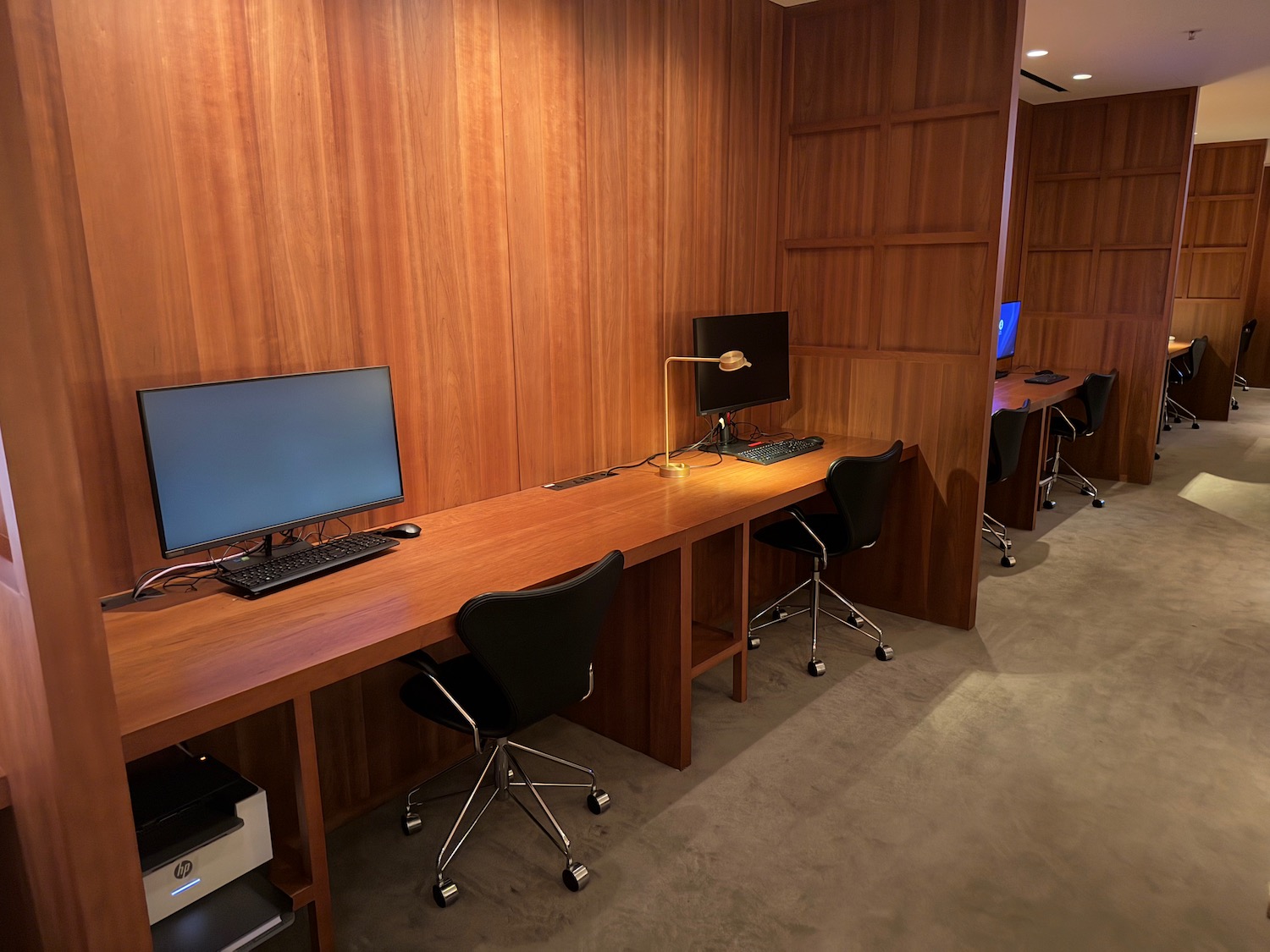a room with a desk and computer