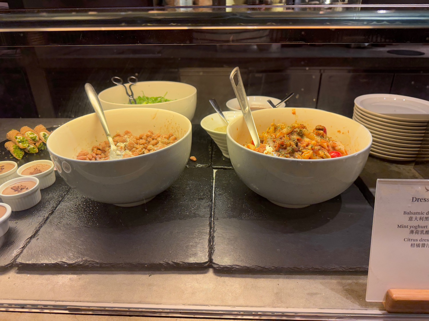bowls of food in a glass case