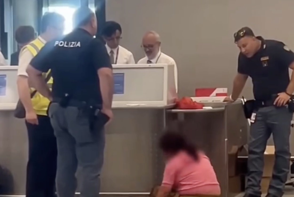 a group of people standing around a counter