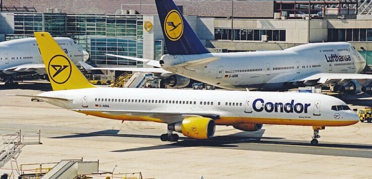 a group of airplanes at an airport