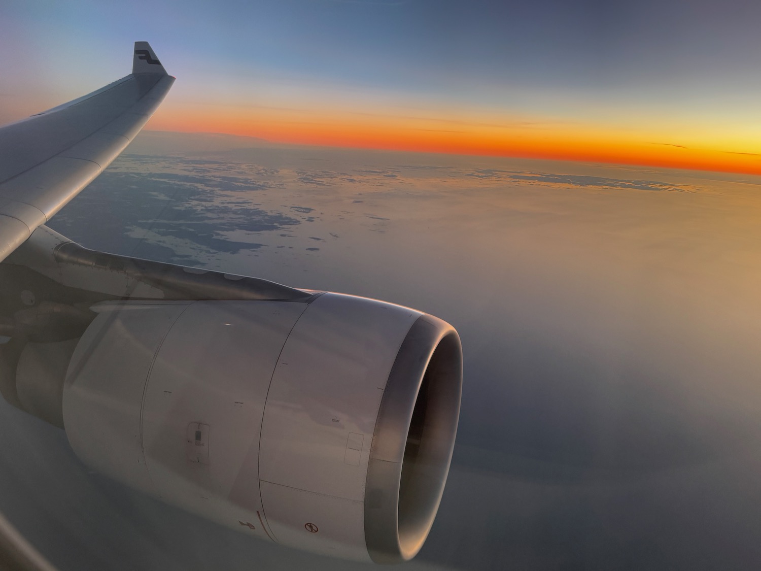 an airplane wing and the sky