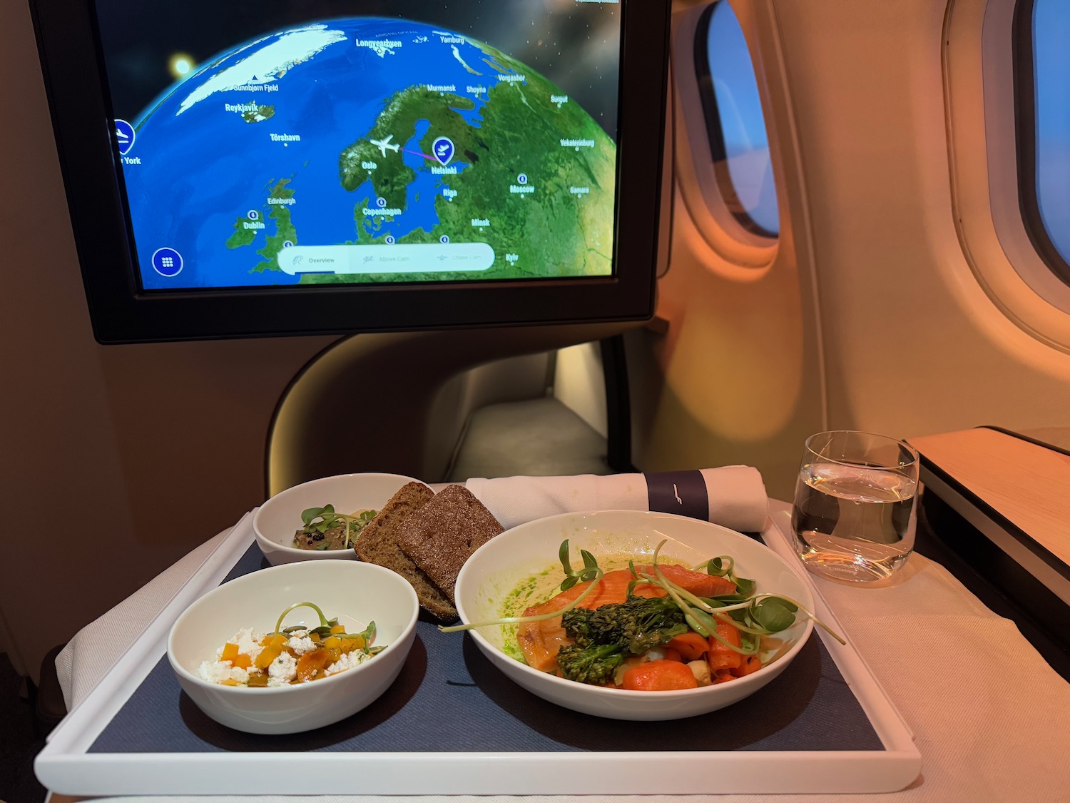 a plate of food on a tray in front of a television