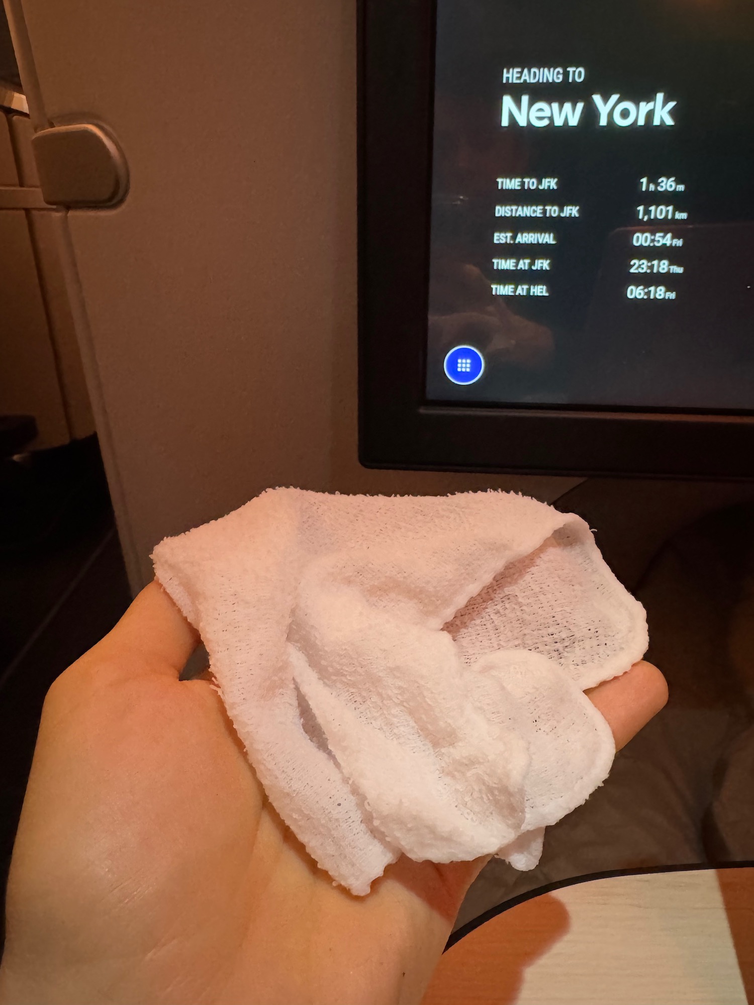 a hand holding a white towel