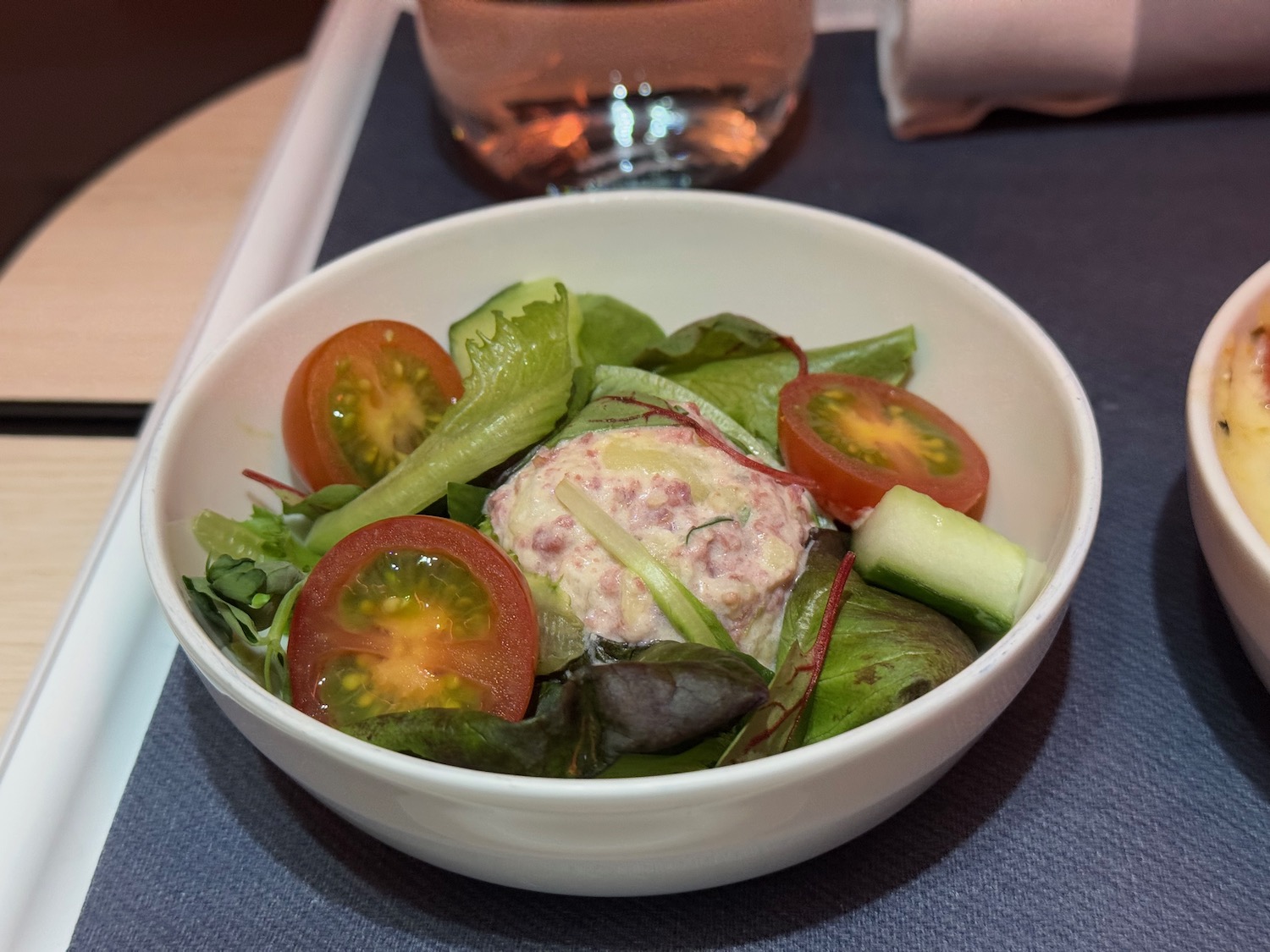 a bowl of salad with tomatoes and cucumbers