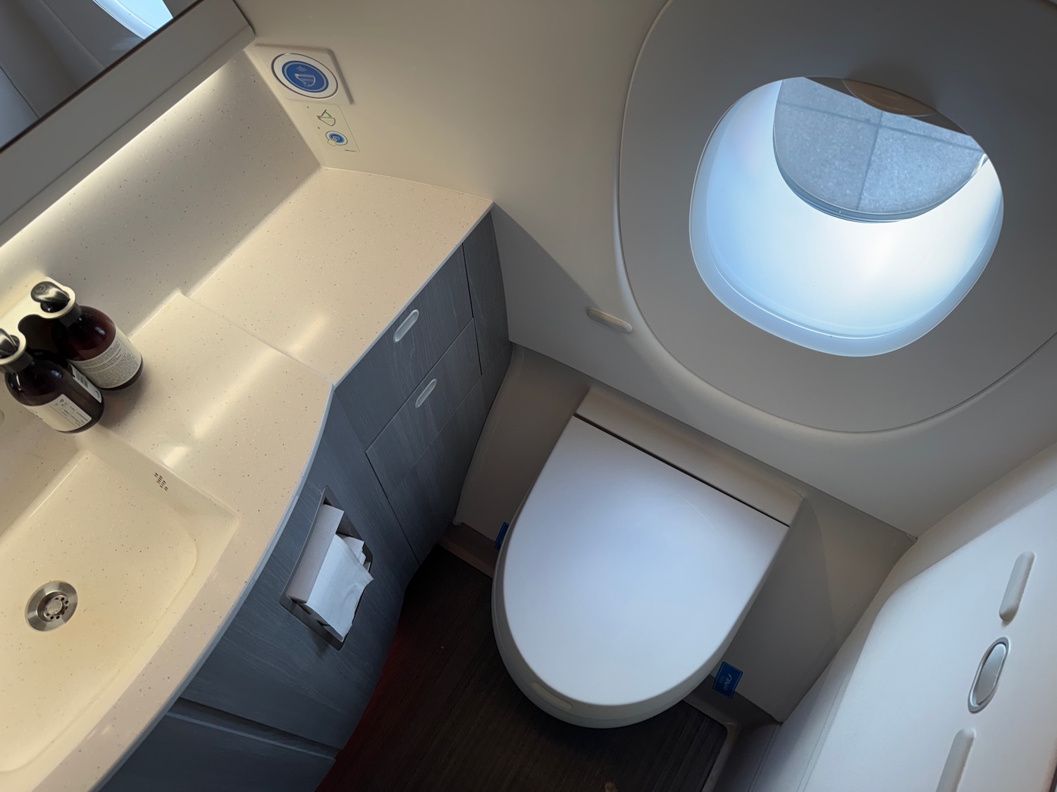 a toilet and sink in a bathroom