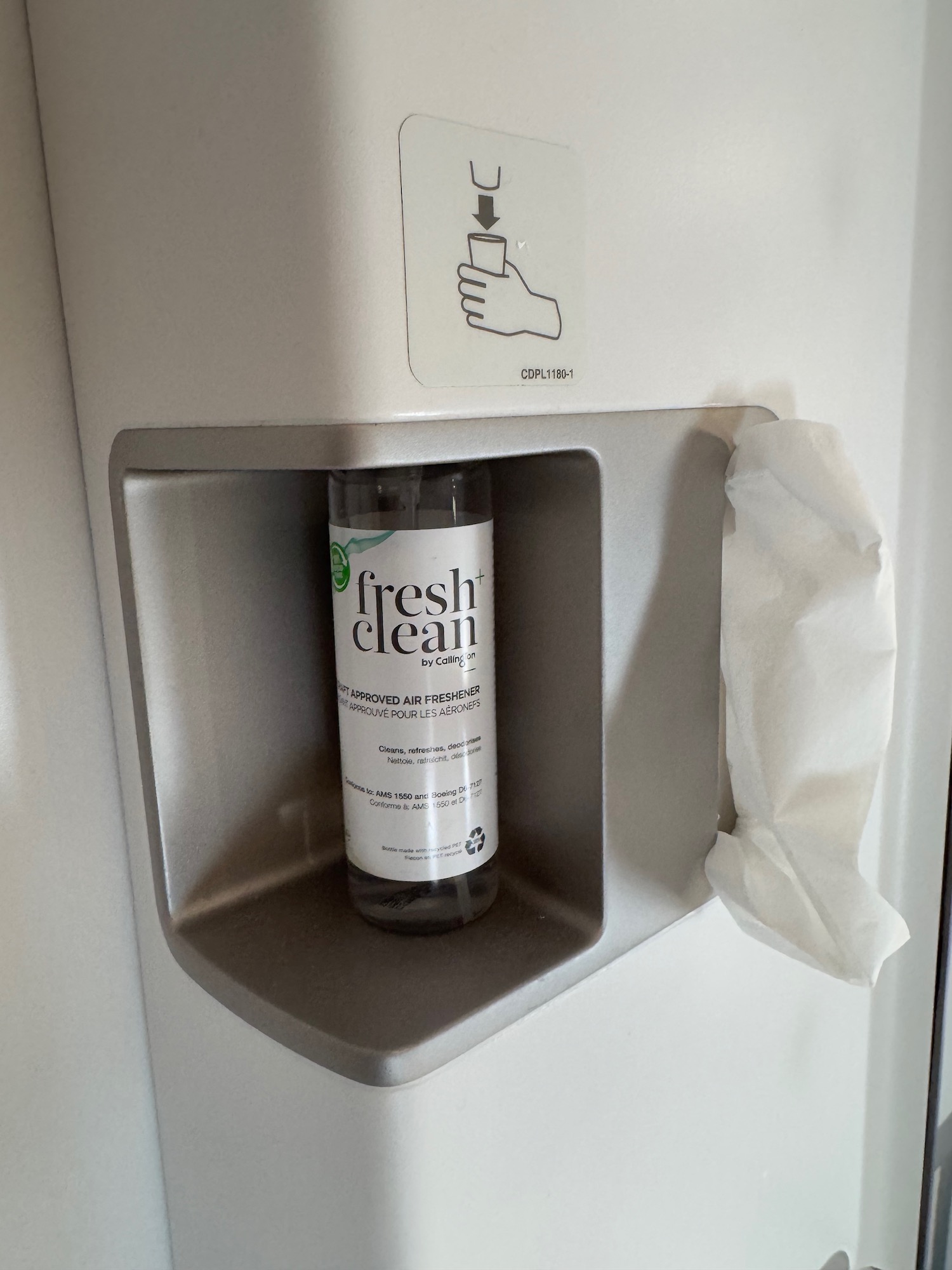 a bottle of hand sanitizer in a hand sanitizer dispenser