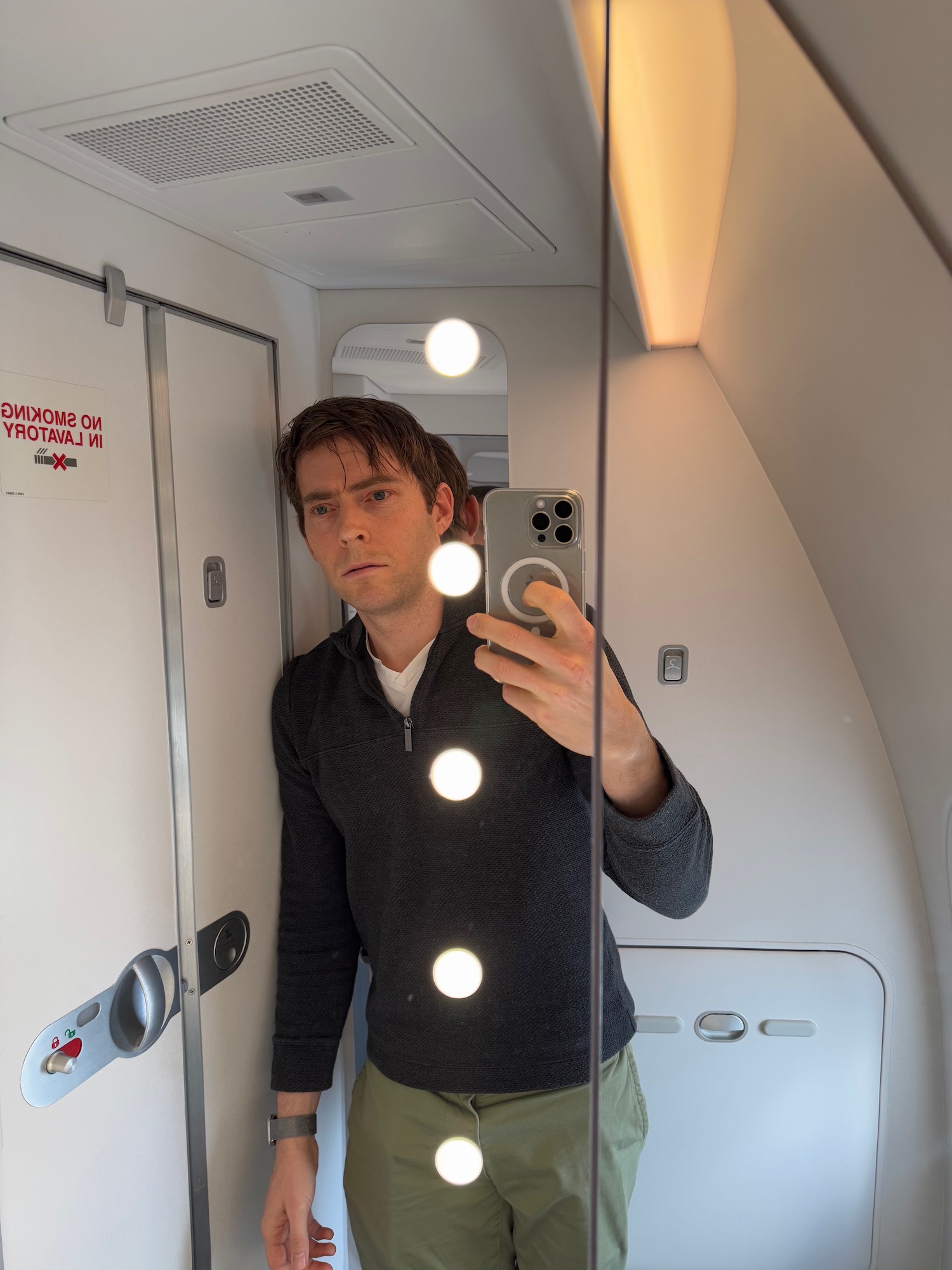 a man taking a selfie in a mirror