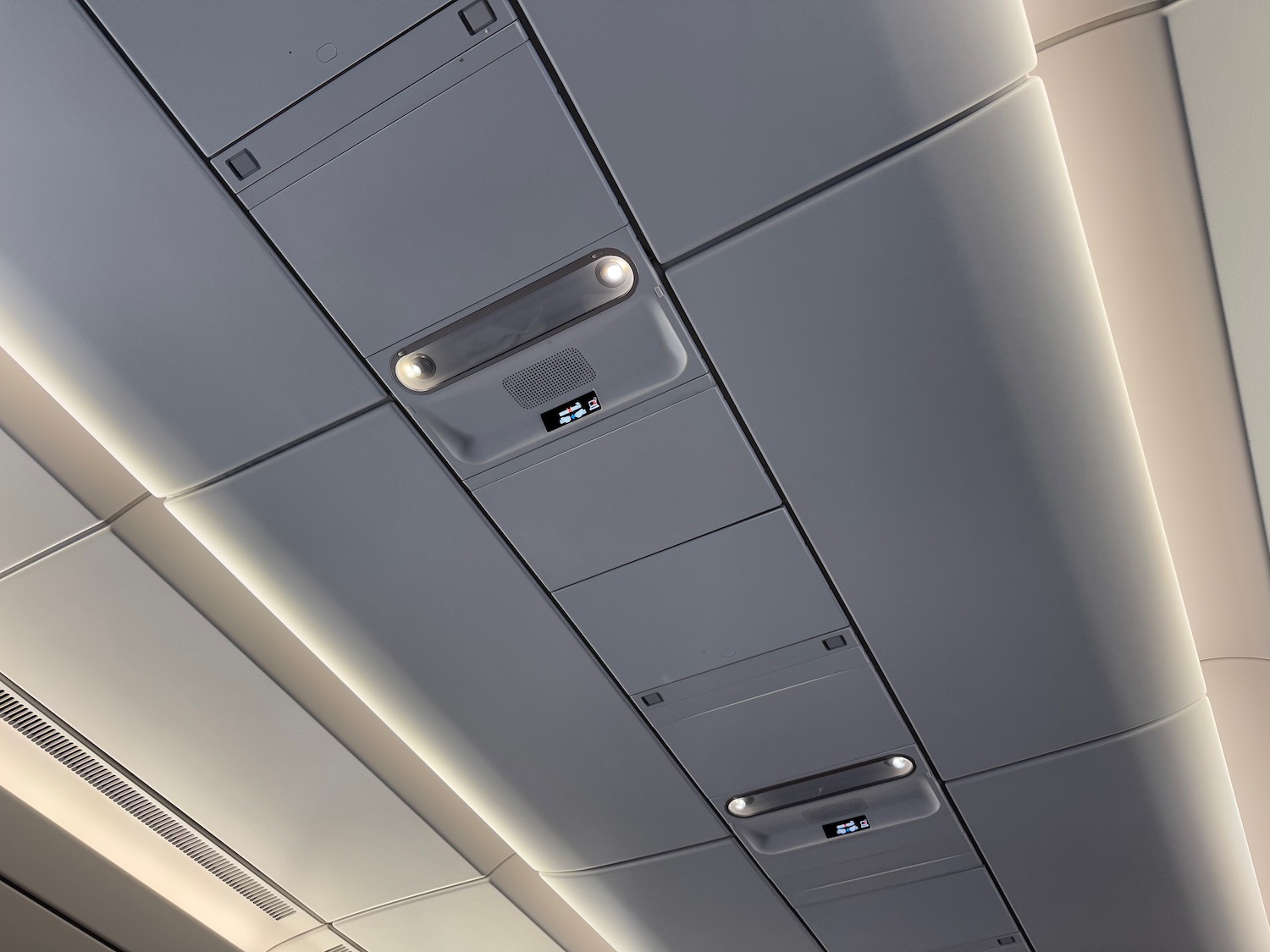 a ceiling with lights and a sign