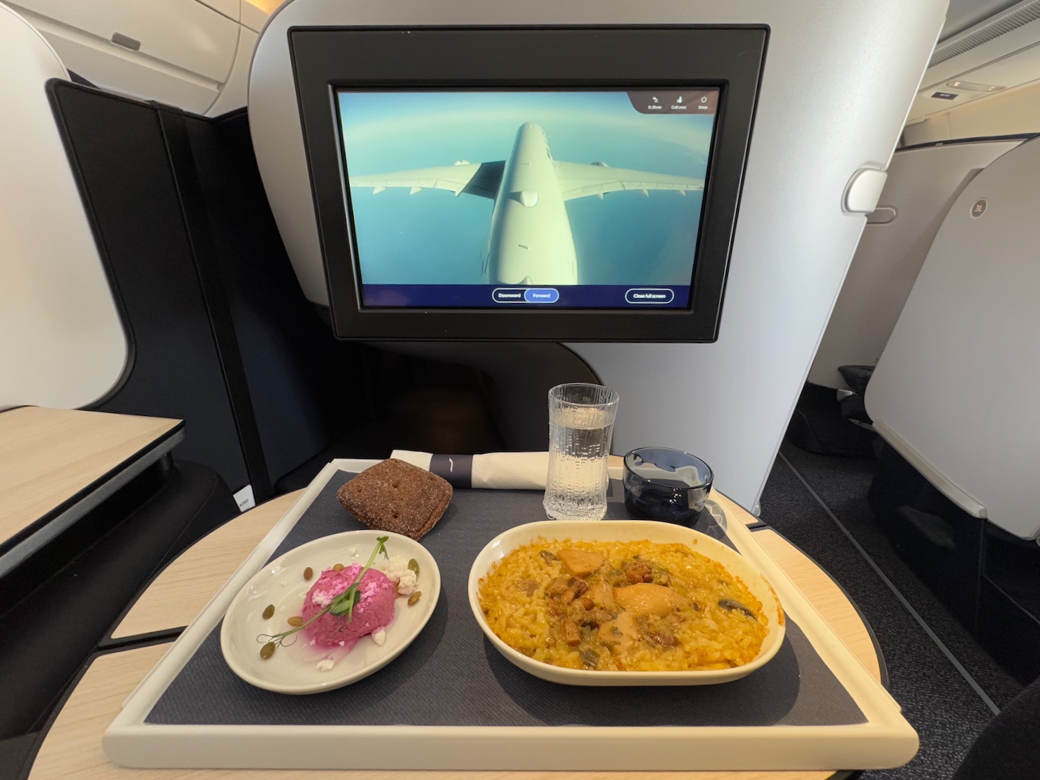 a tray with food on it and a television on the wall