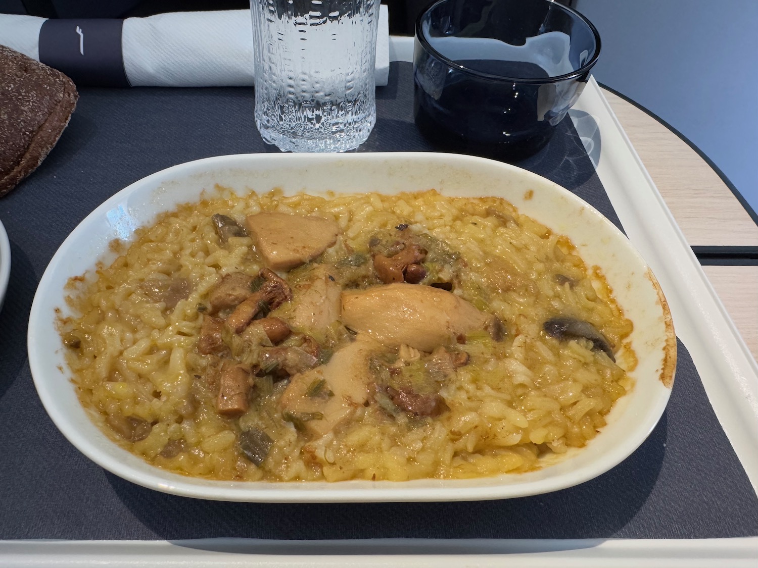 a bowl of rice and chicken on a tray