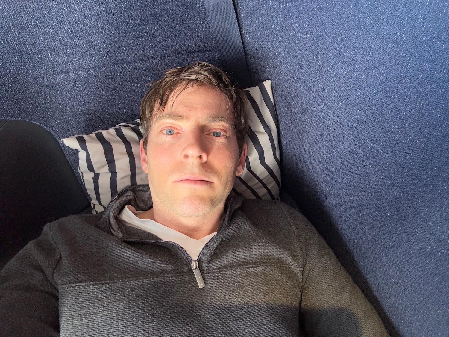 a man lying on a pillow