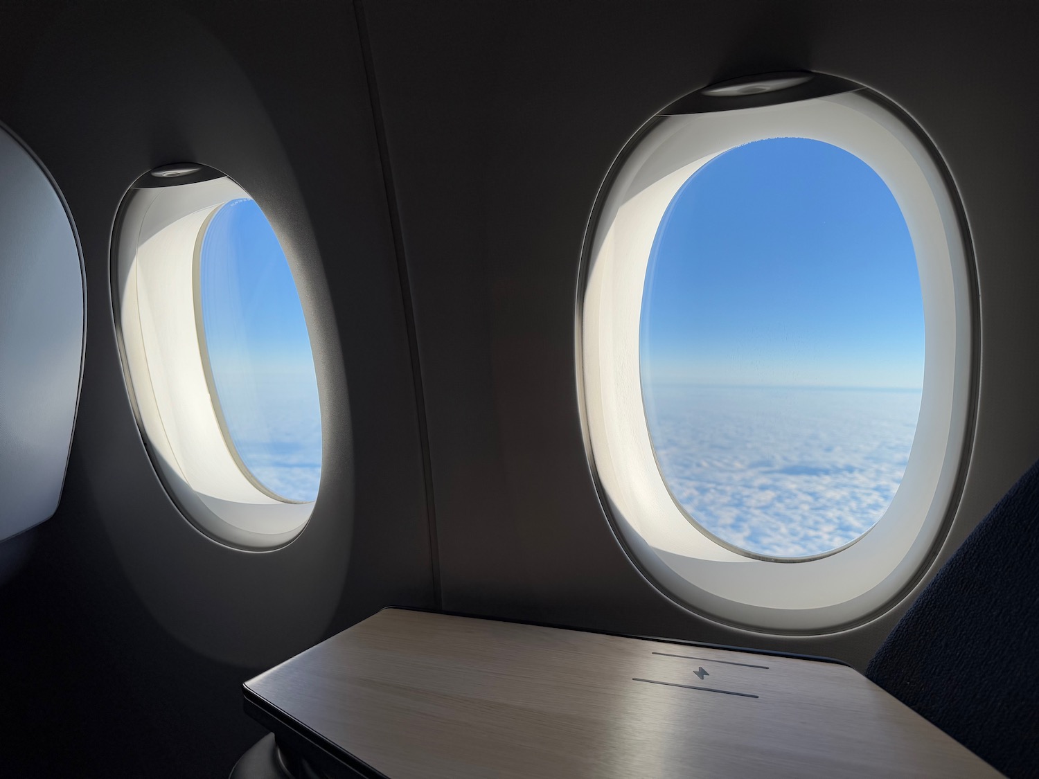 two windows with a table and a table on the side