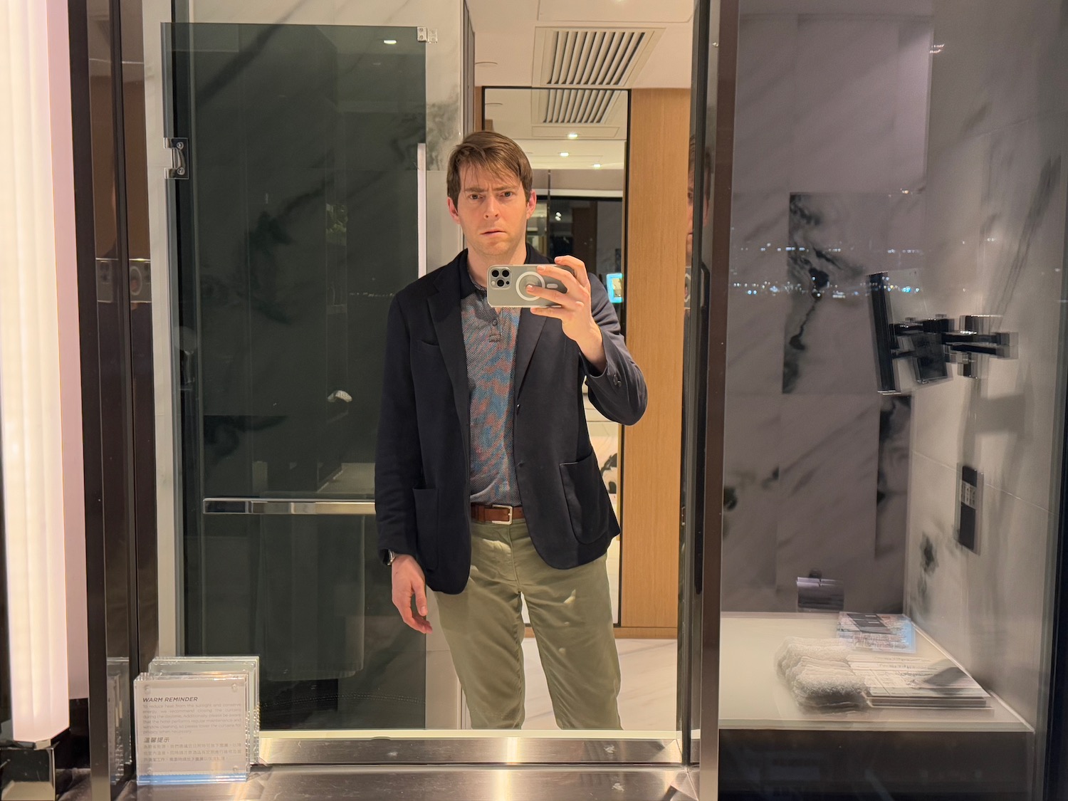 a man taking a selfie in a mirror