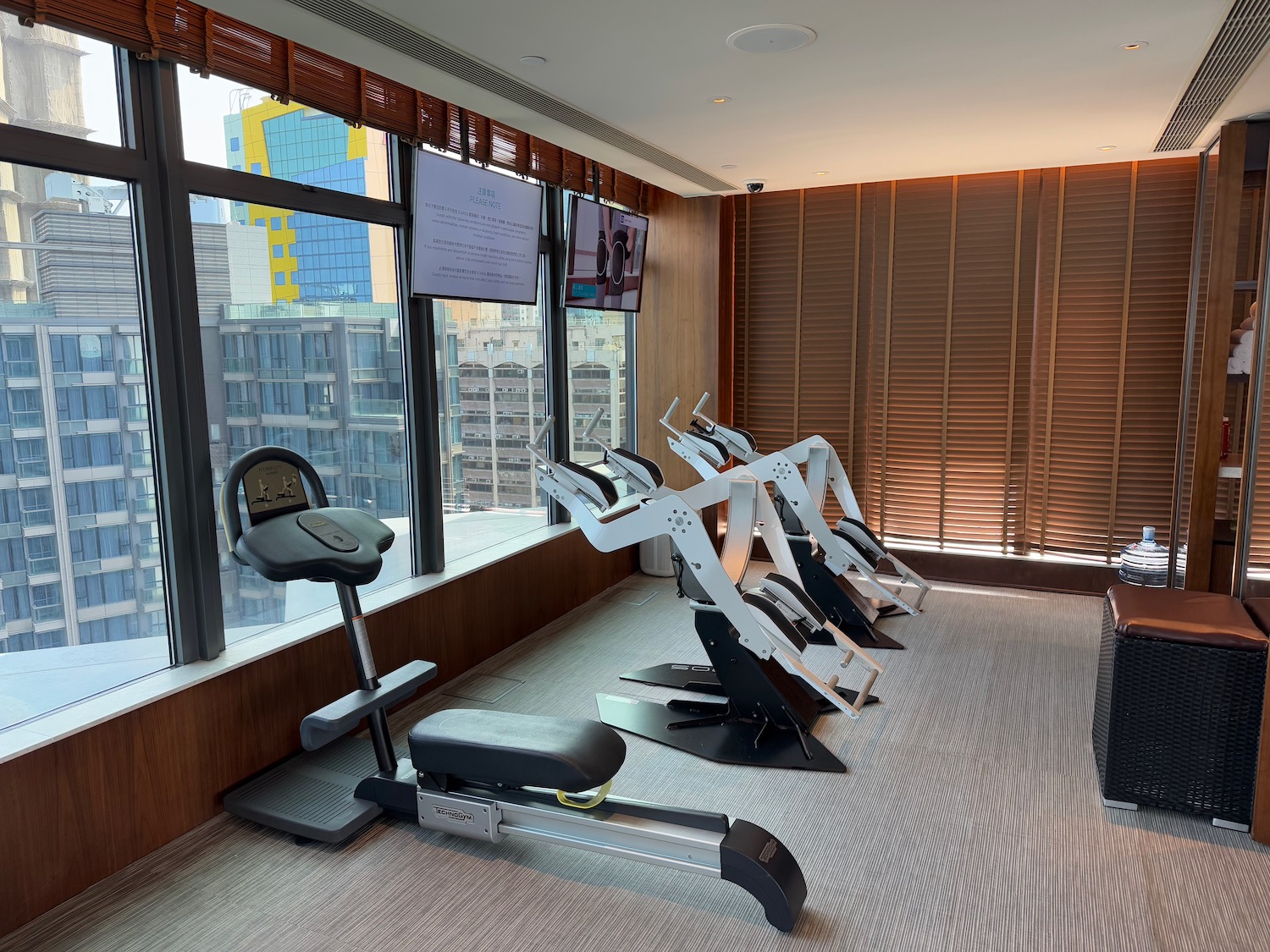 a room with exercise bikes and a large window
