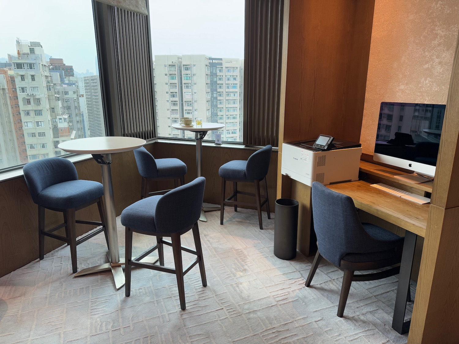 a room with a table and chairs and a television