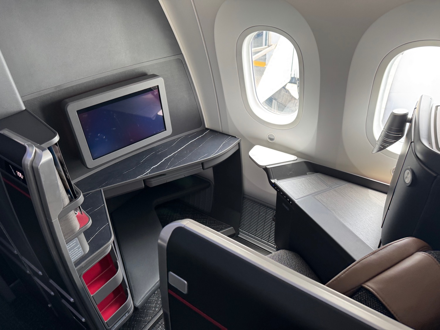 a desk and chair in an airplane