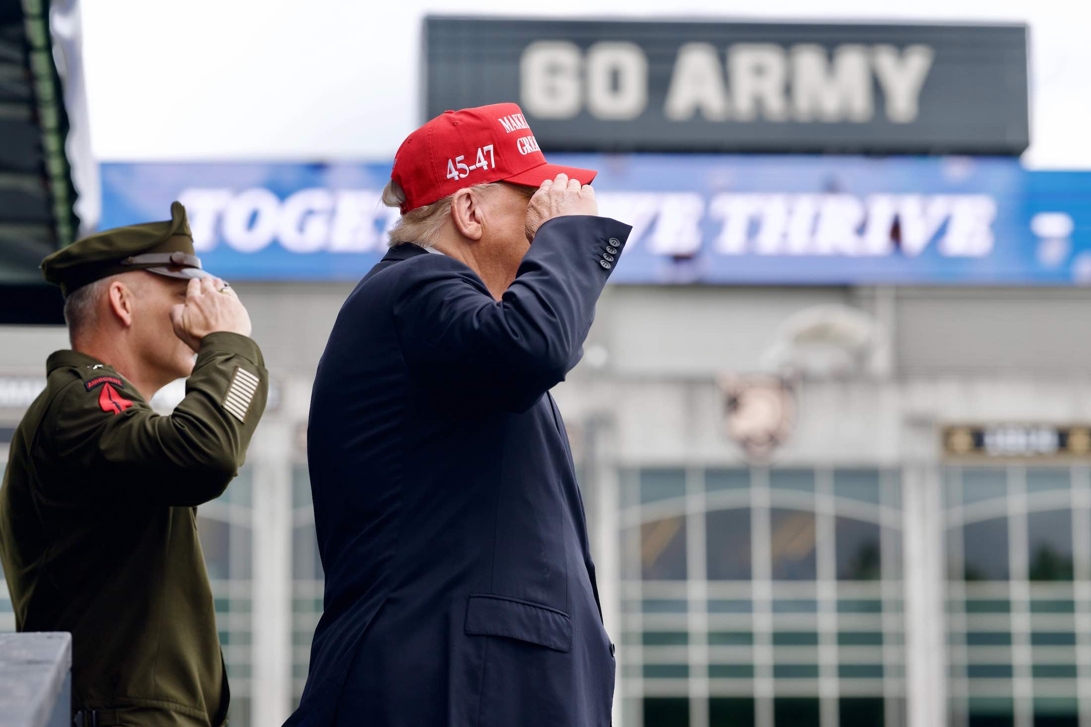 a man in a red hat and a man in a suit