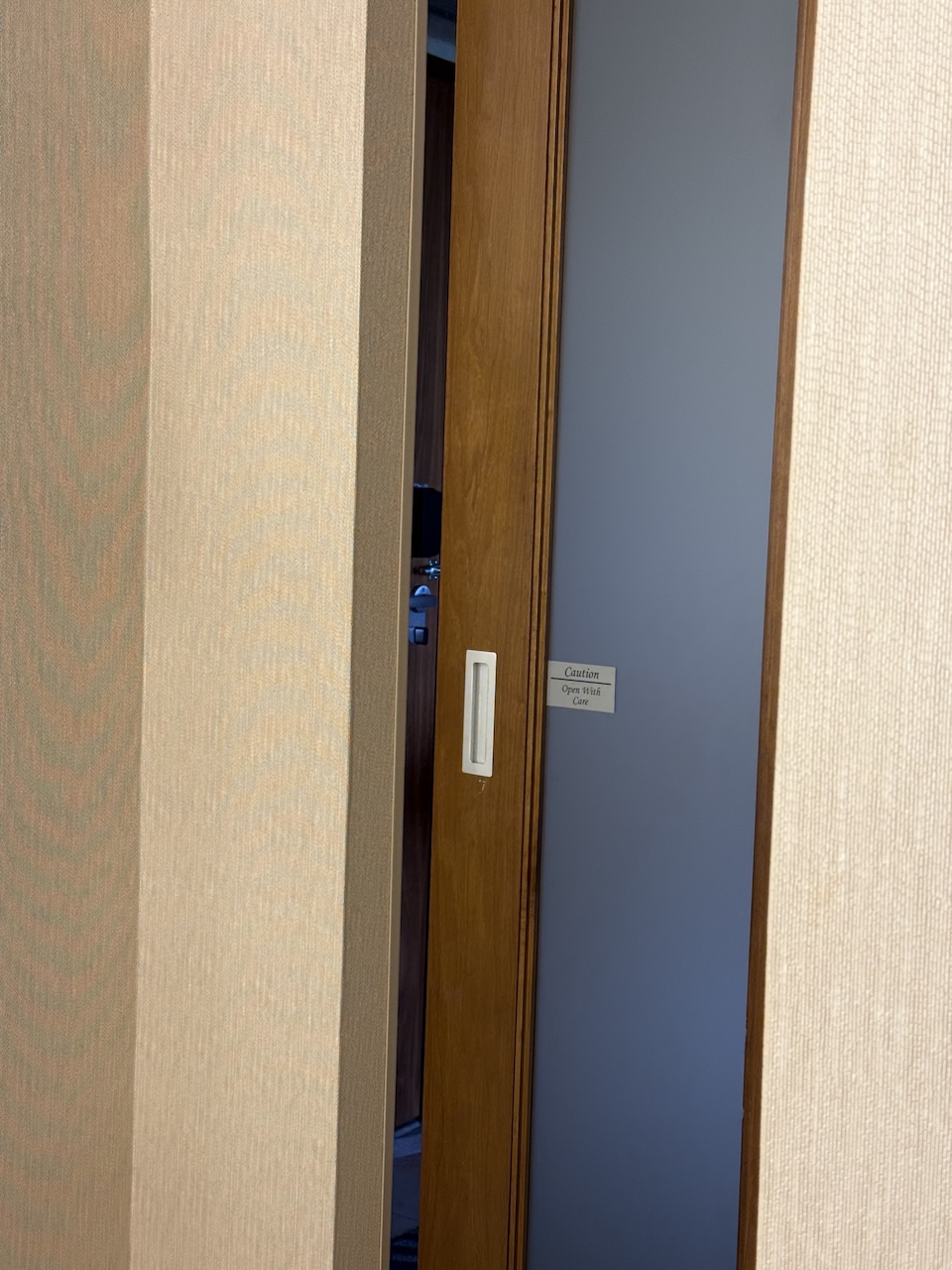 hotel bathroom barn door gap from toilet