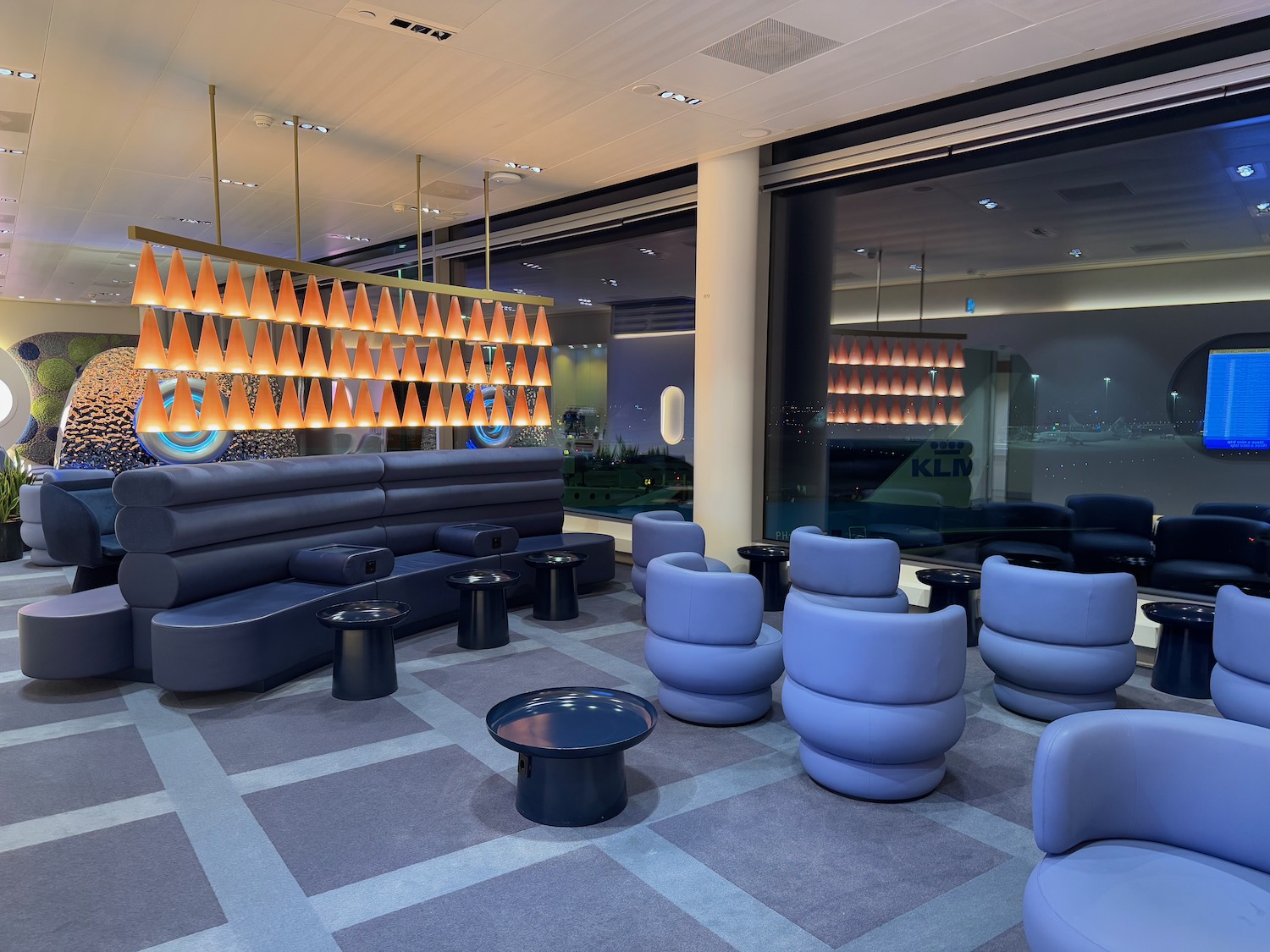 a room with a couch and tables
