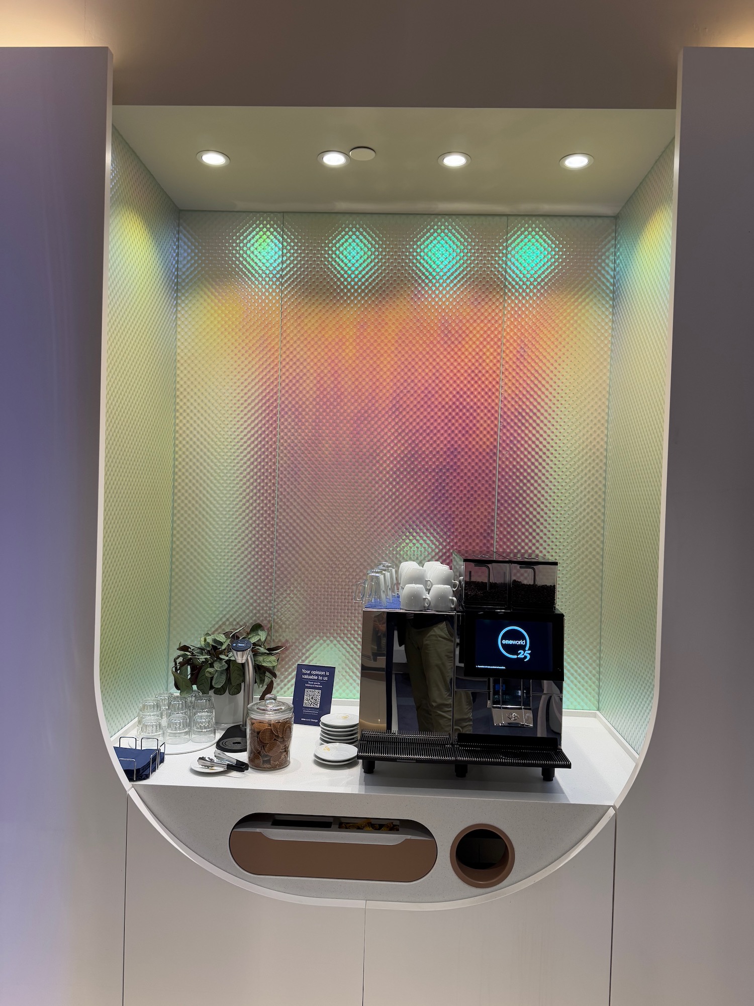 a coffee machine and coffee maker in a white wall