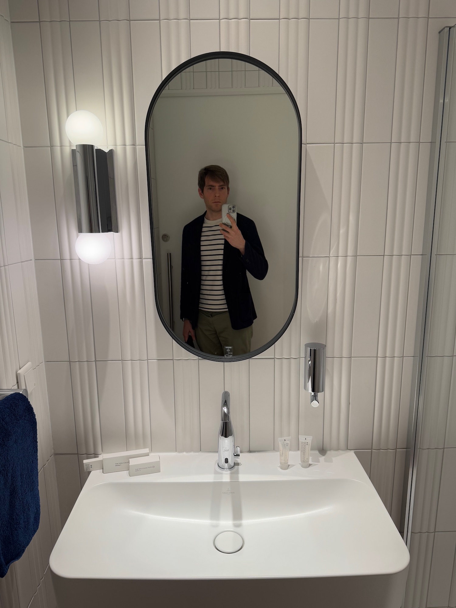 a man taking a selfie in a bathroom