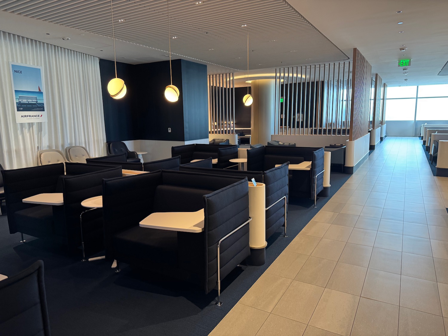 a room with black chairs and tables