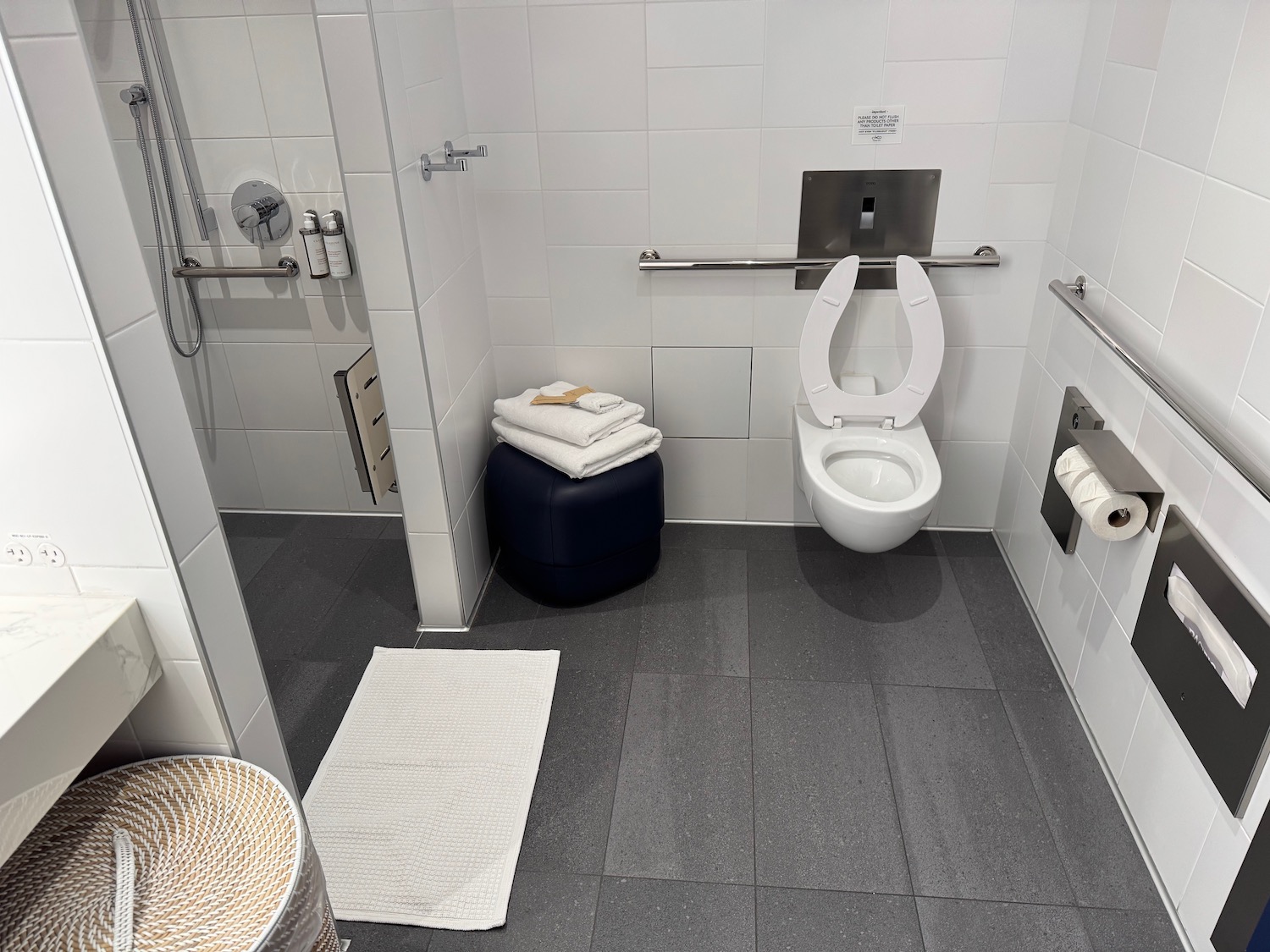 a bathroom with a toilet and a towel