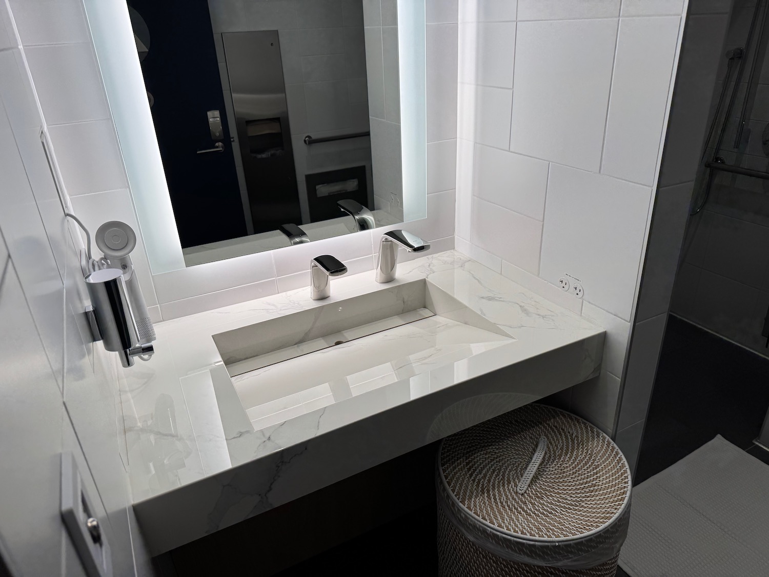 a bathroom with a mirror and a sink