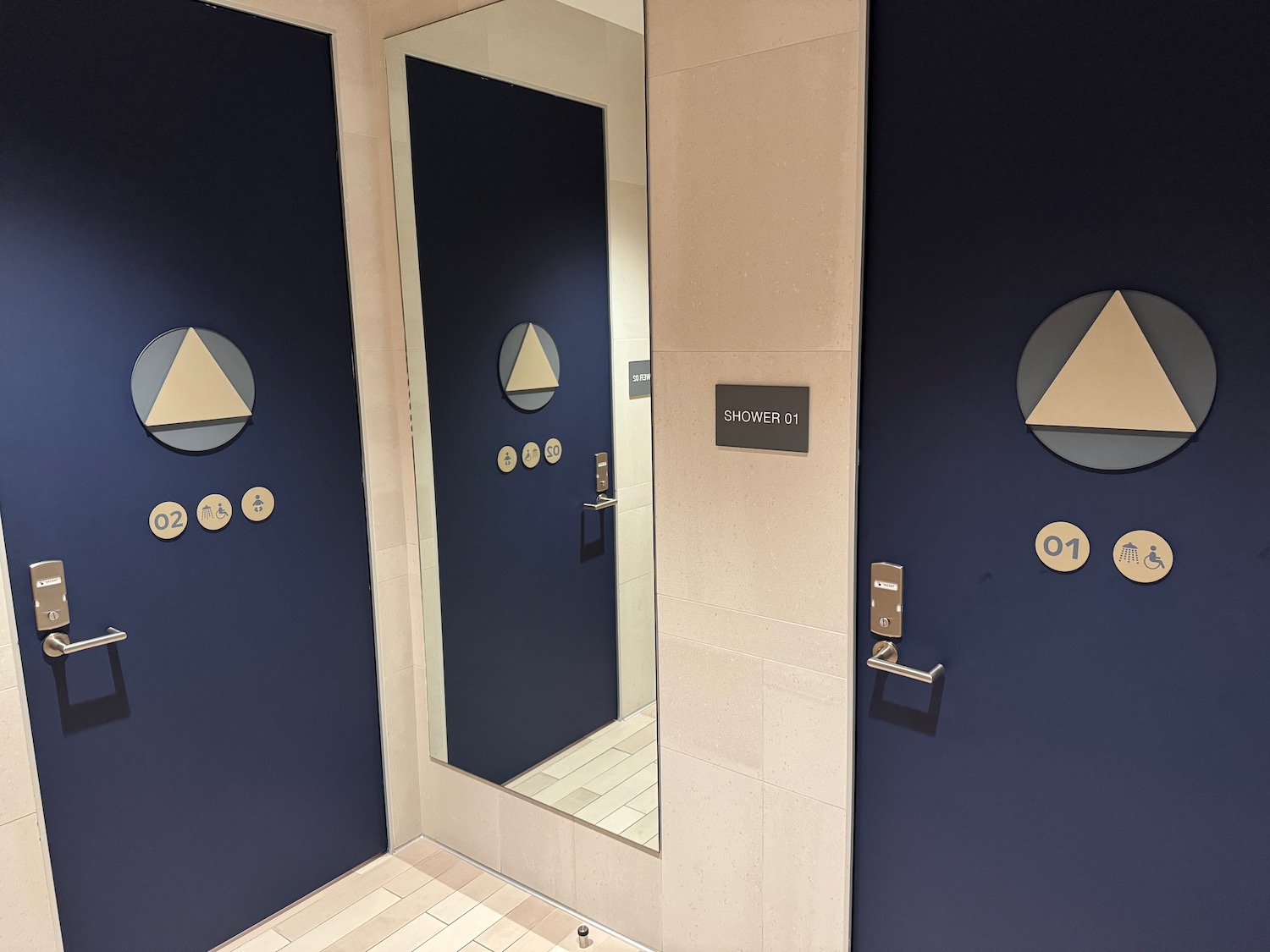 a mirror and doors in a bathroom