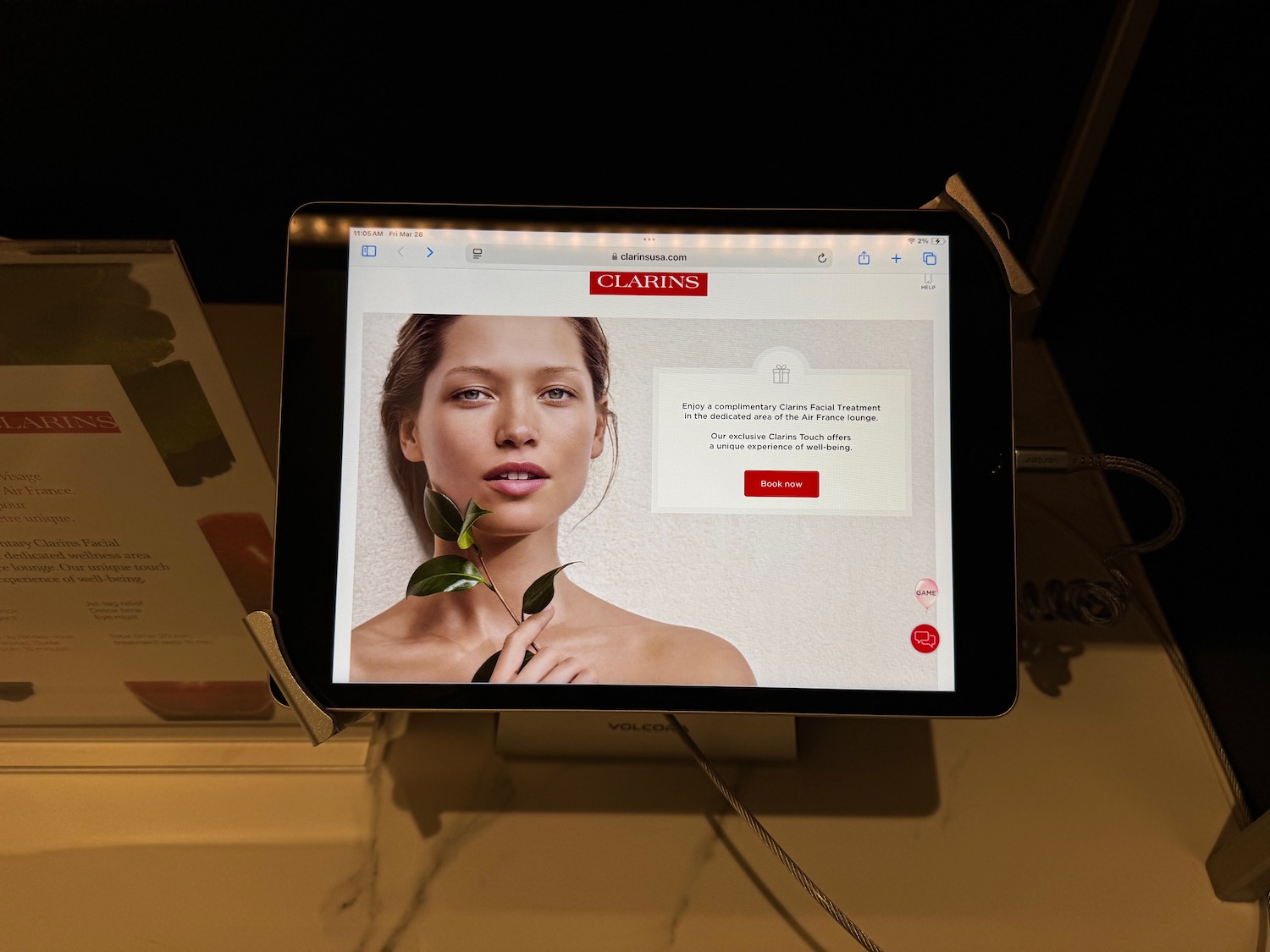 a tablet with a picture of a woman on it