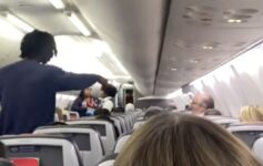 a person standing in an airplane