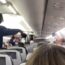 a person standing in an airplane