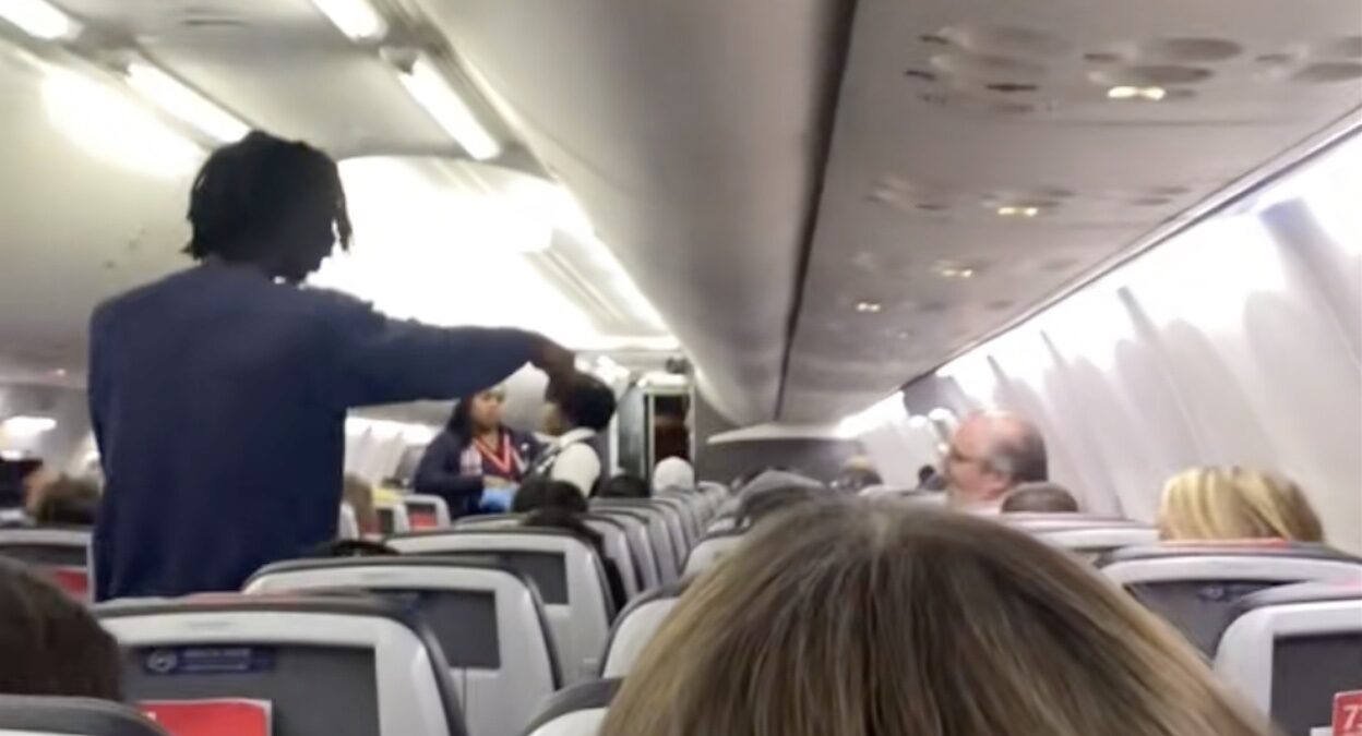 a person standing in an airplane
