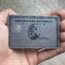 a hand holding a credit card