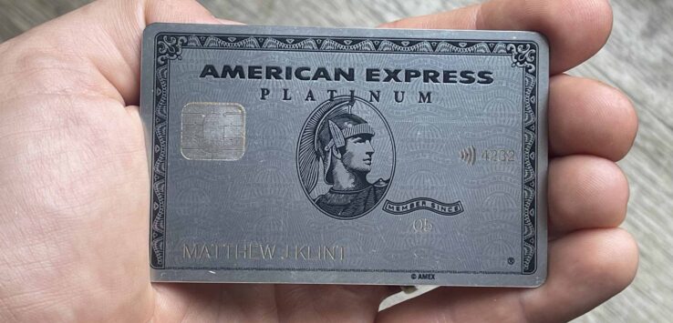 a hand holding a credit card