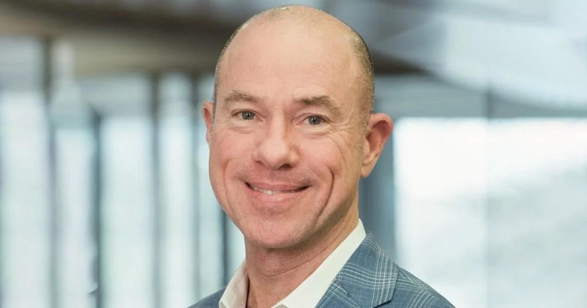 a man smiling for a picture