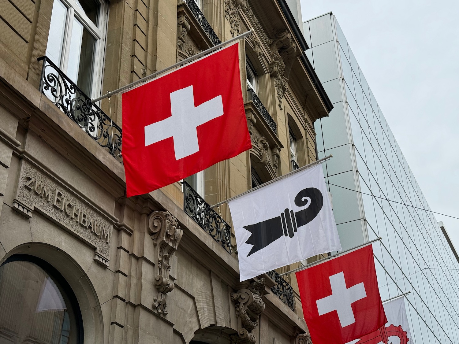 a group of flags on a building