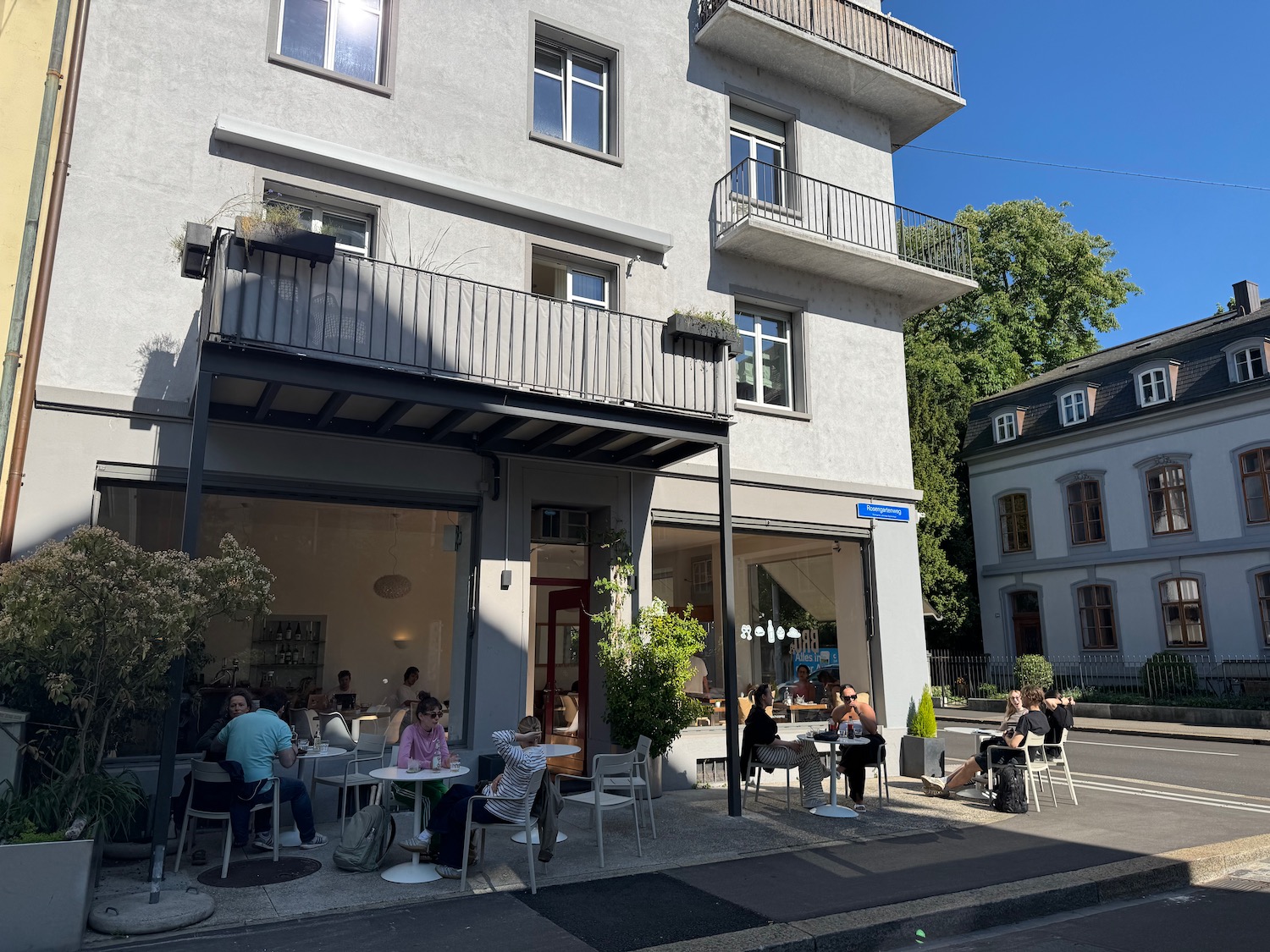 a group of people sitting outside a building