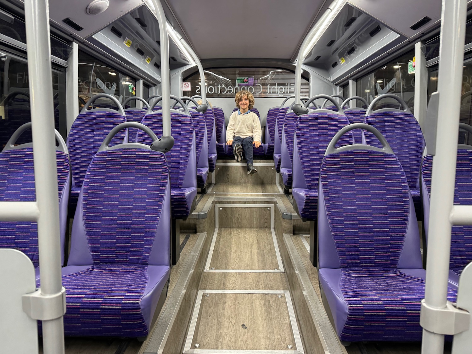 a woman sitting on a bus