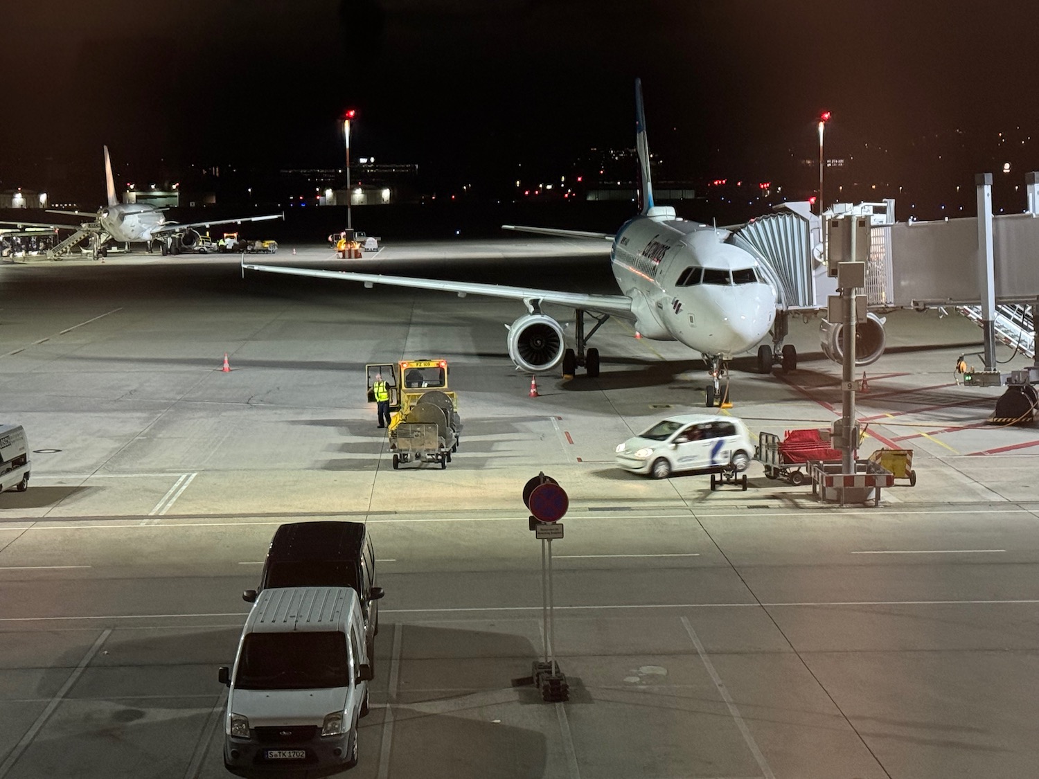an airplane on a tarmac at night
