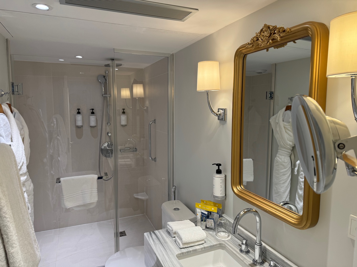 a bathroom with a mirror and a shower
