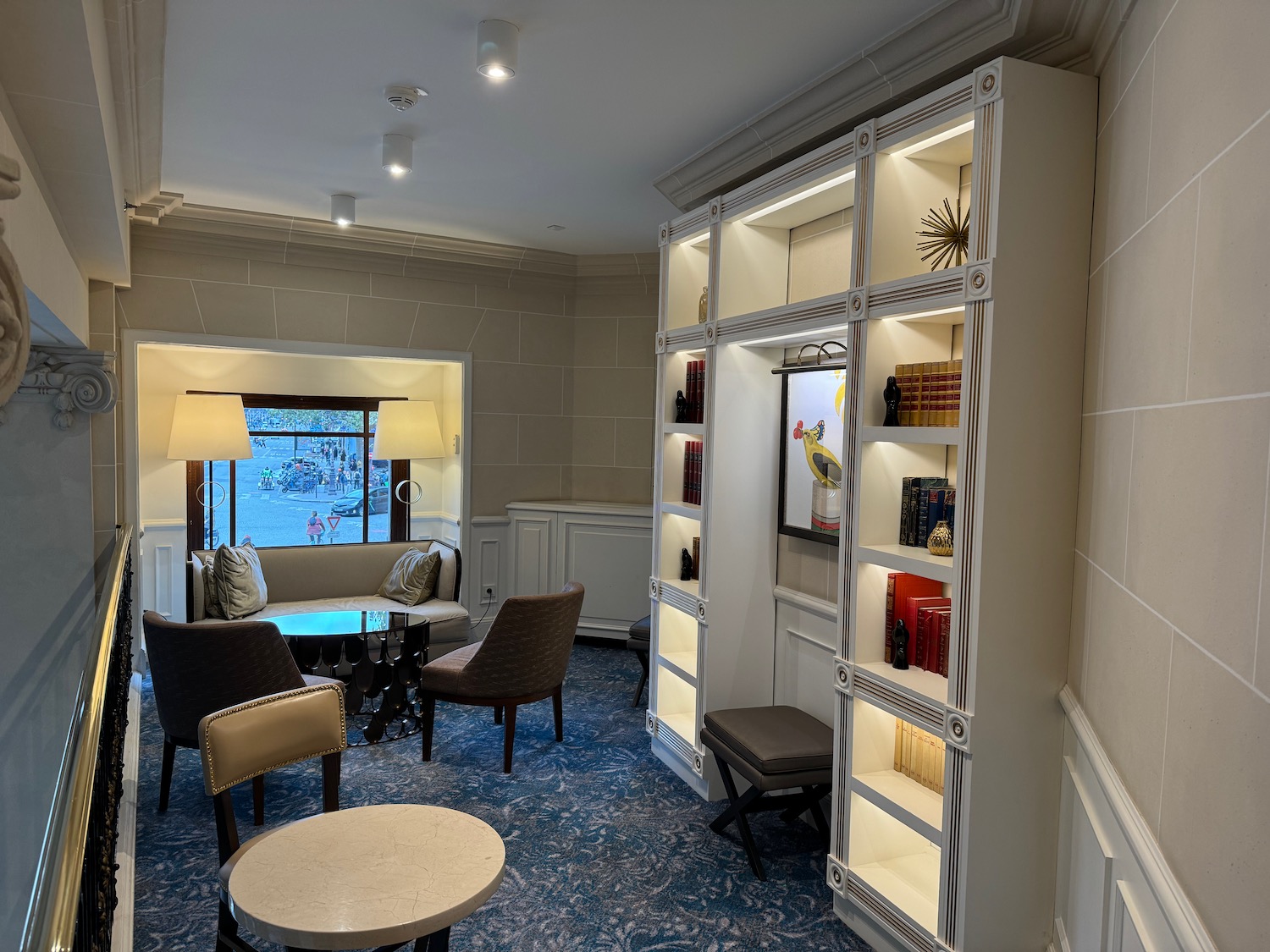 a room with a round table and chairs