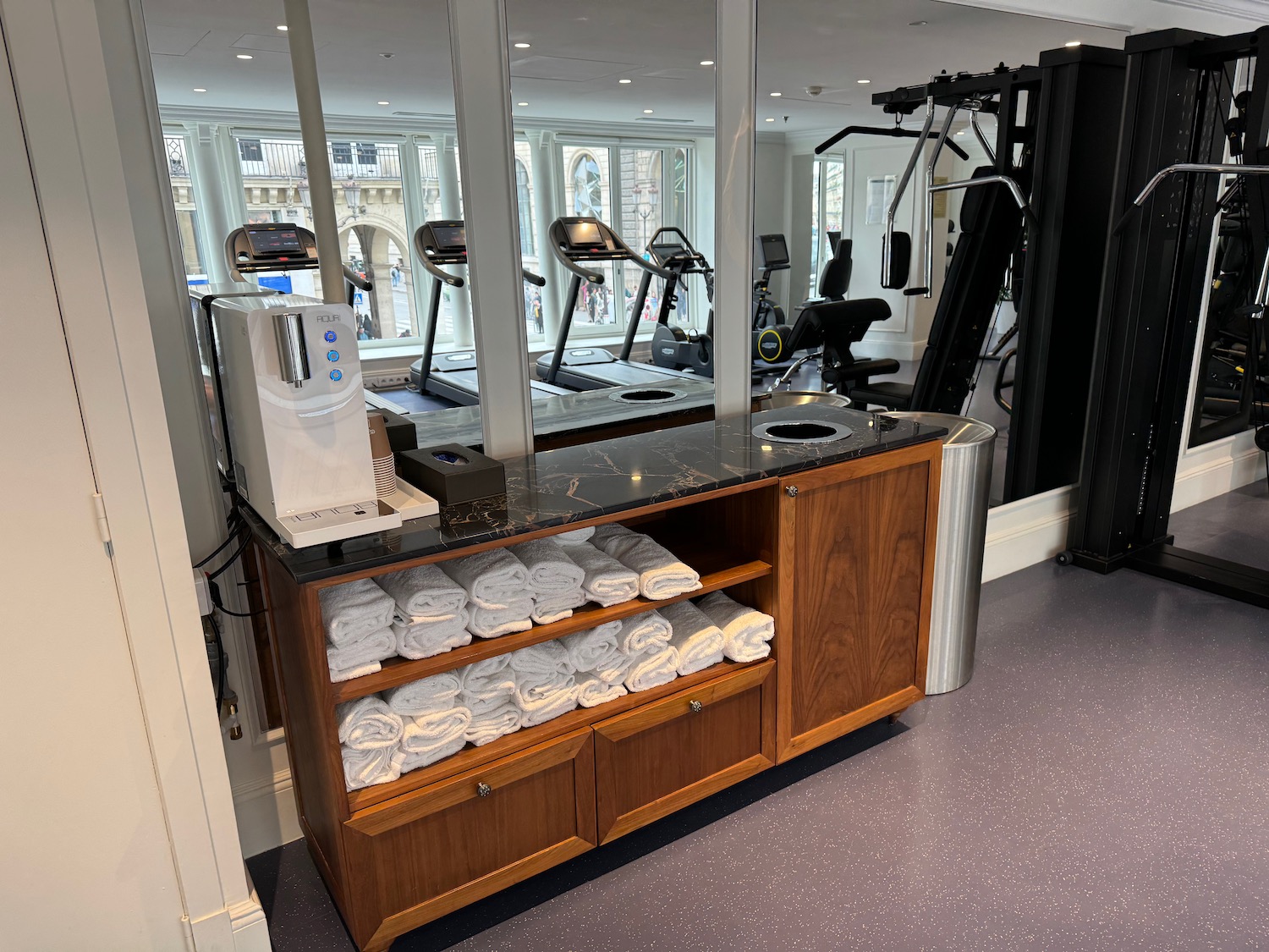 a gym with a mirror and exercise equipment