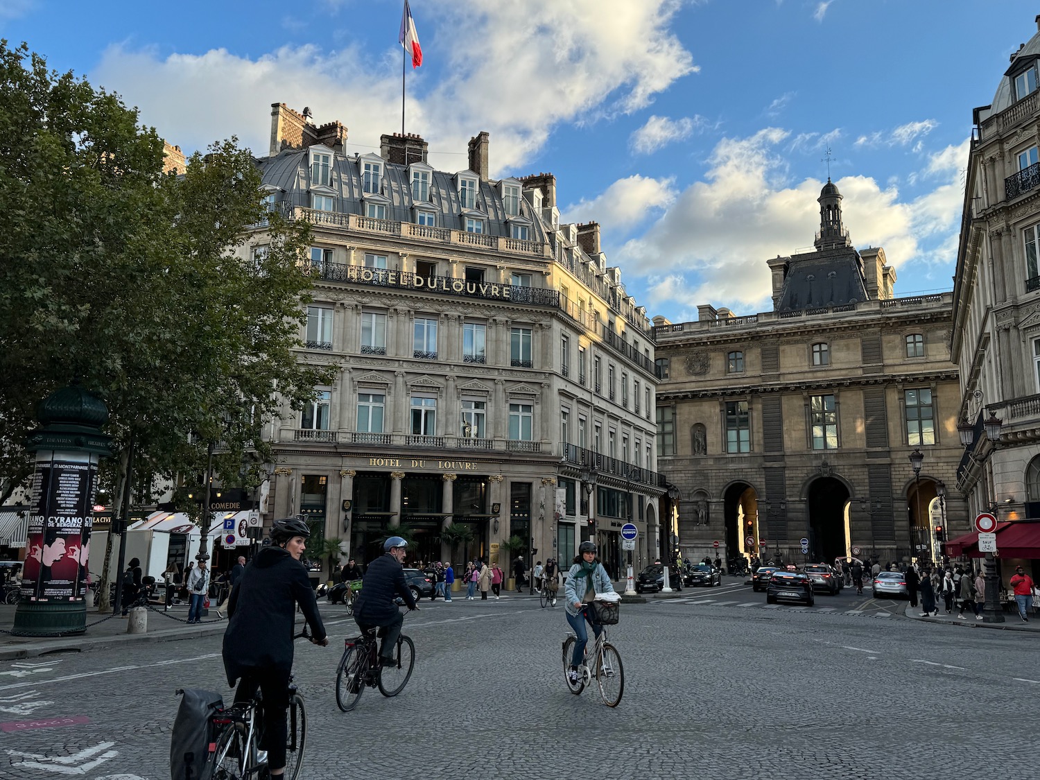 people riding bicycles in a city