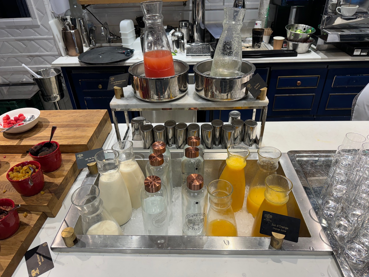 a group of bottles of liquid in a metal tray