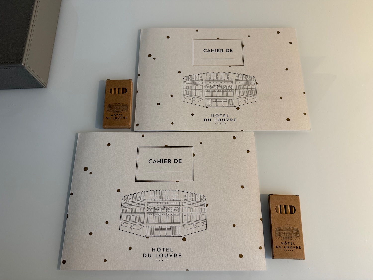 a couple of papers with a picture of a stadium and a box