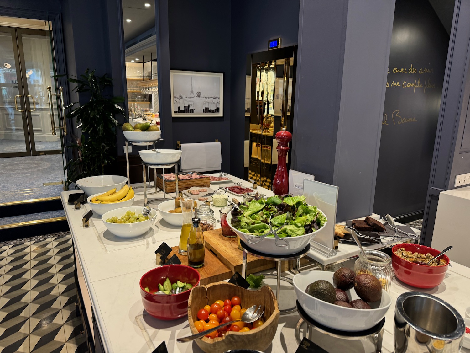 a buffet table with bowls of food