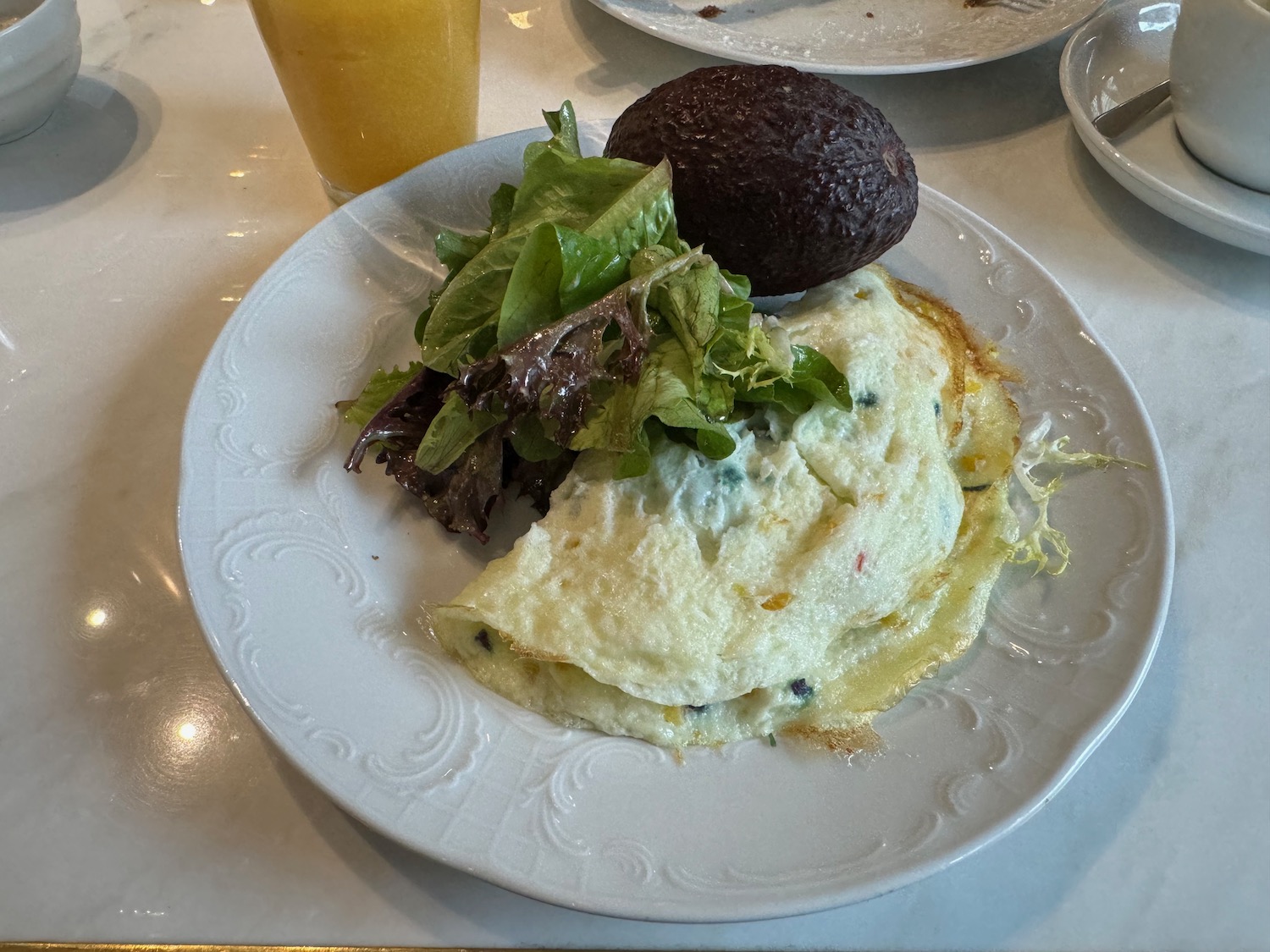a plate of food with a drink